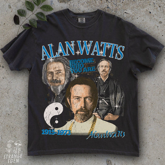 Black t-shirt with graphic design of Alan Watts and text on a concrete surface